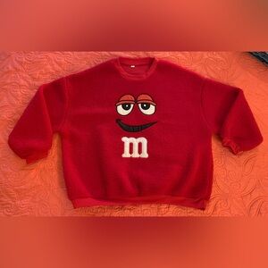 M and M fuzzy sweatshirt.